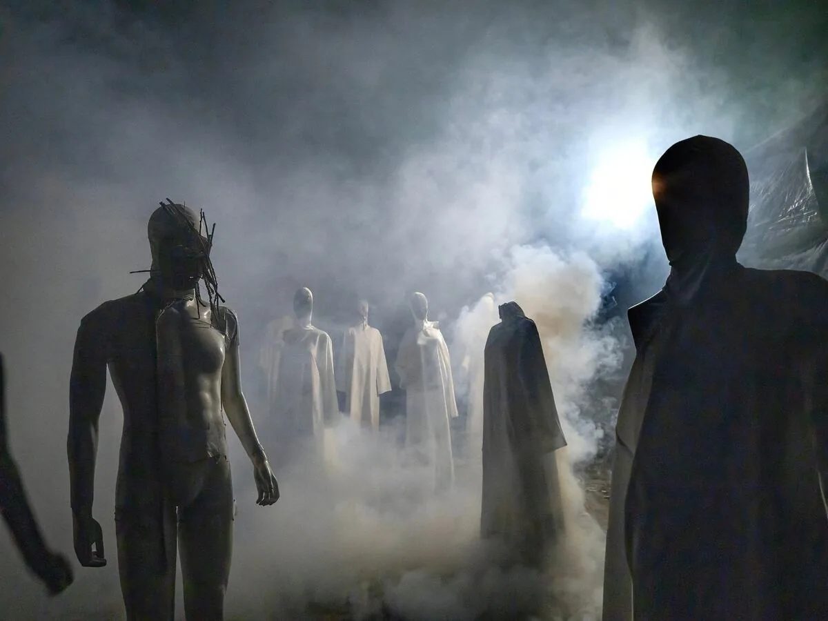 Mannequins emerge from fog in an outdoor Exiled Trail of Terrors set